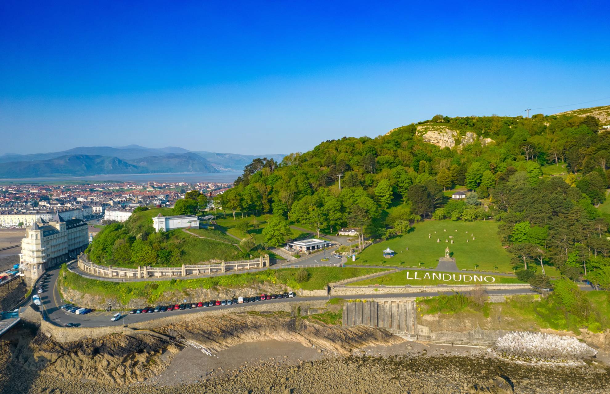 Llandudno's coastal landscape with historic sites and lush greenery.