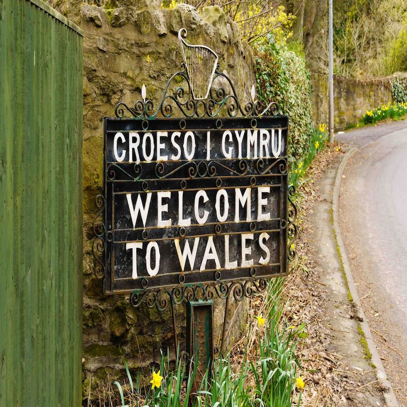 Bilingual Welcome to Wales sign in Welsh and English marking the border between England and Wales on the old coaching route at the town of Chirk UK